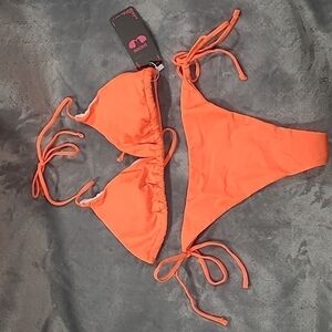 SHEKINI Women's Halter Top Bikini. Tie on Bottoms. Size medium. Orange